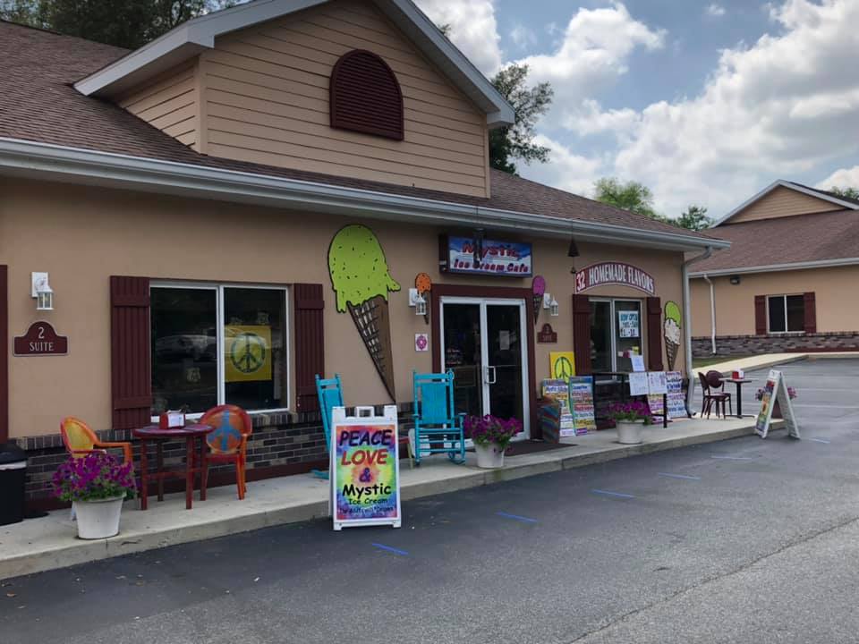 Image of front of Mystic Ice Cream Shop showing outdoor decorations.
