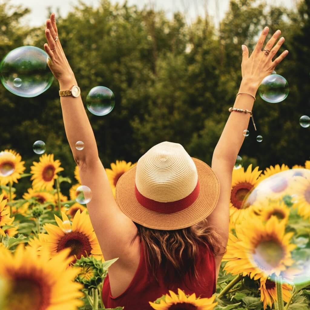 Woman in sunflower field