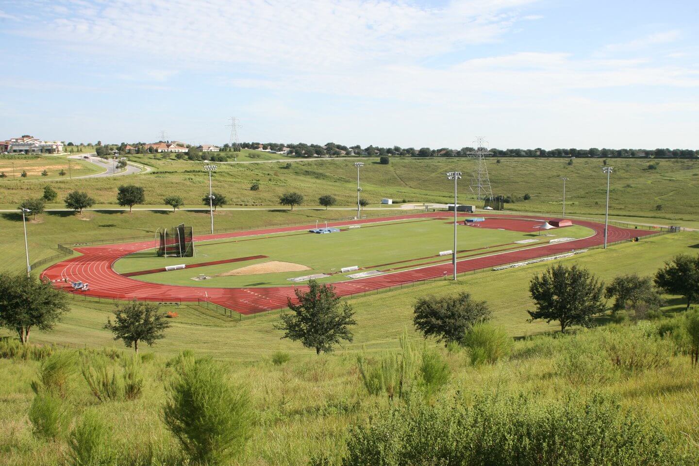 National Training Center's red turf track and green grass fields